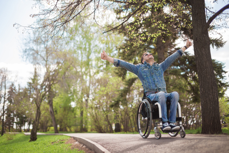 Cannabis and MS happy person in wheelchair