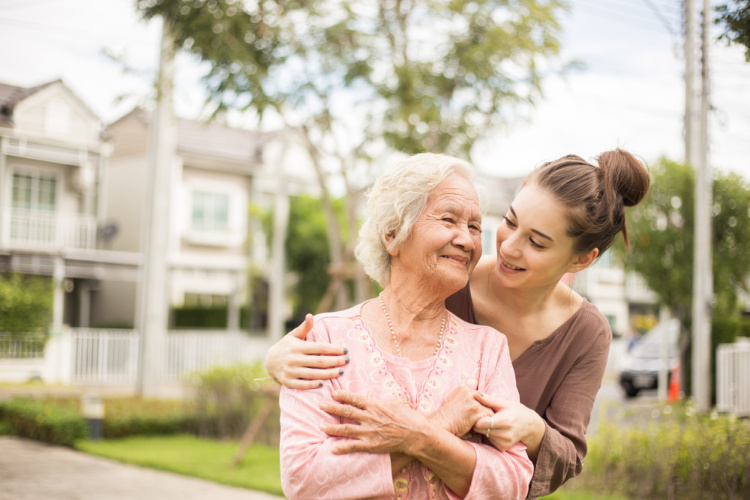 Cannabis for Alzheimers young care taker hugging woman